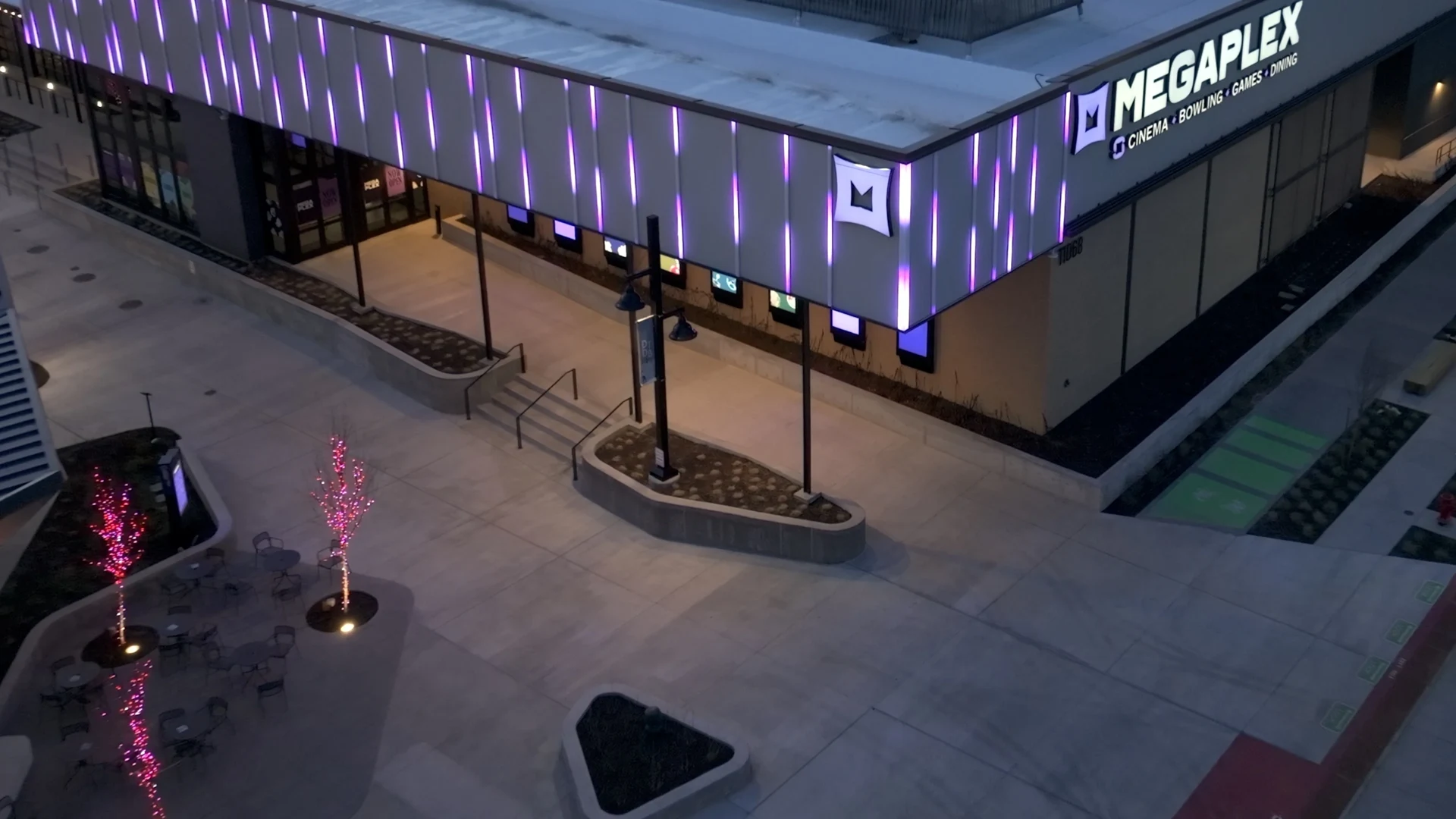 A commercial building with purple JellyFish permanent exterior lighting