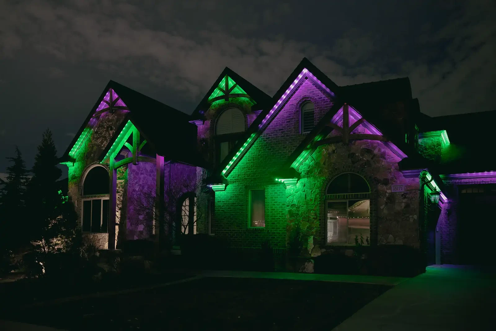Permanent lights set to green and purple Halloween colors